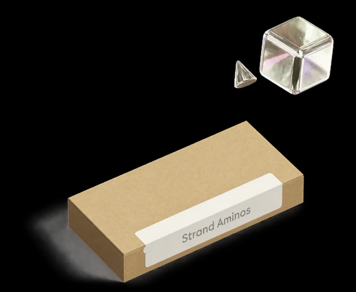 A Strand Aminos delivery box beside a clear glass form